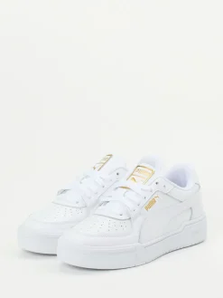 Damen Puma – Sneaker aus Glattleder mit Goldakzenten